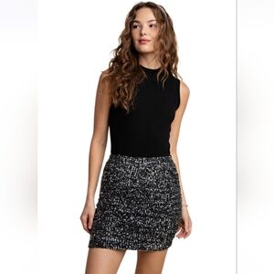 NWT Kori, Sparkling Silver Sequin Black Skirt Size M.